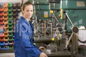 Machinist working on machine