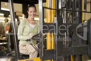 Warehouse worker in forklift