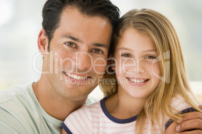 Father and daugther smiling