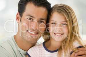 Father and daugther smiling