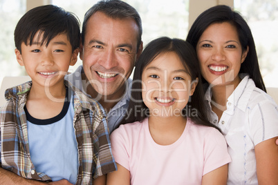 Family in living room smiling