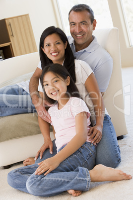 Family in living room smiling