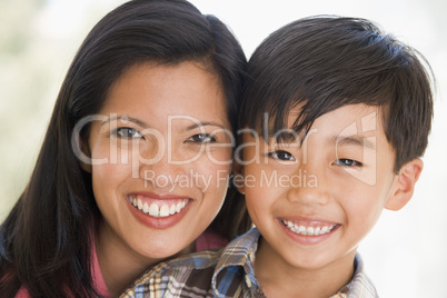 Woman and young boy smiling