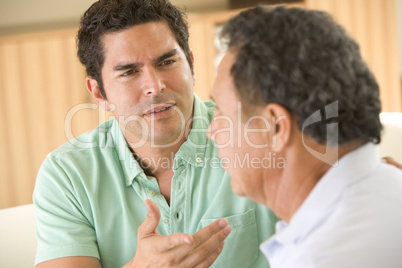Two men in living room arguing