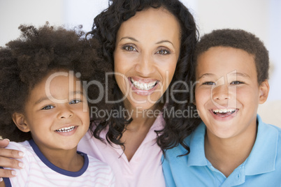 Woman and two young children smiling