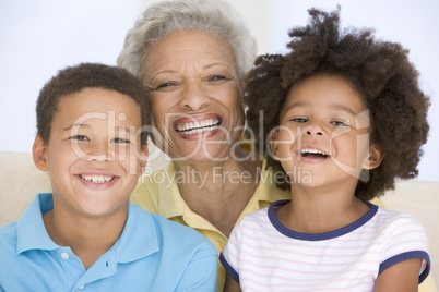 Woman and two young children smiling