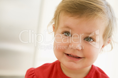 Baby indoors smiling