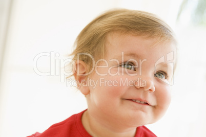 Baby indoors smiling