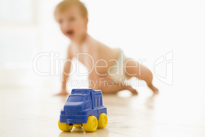Baby indoors with toy truck