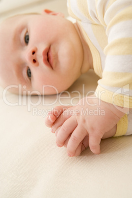 Baby lying indoors