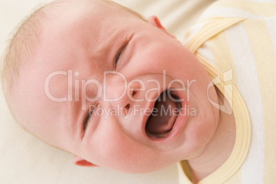 Baby lying indoors crying