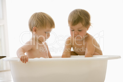 Two babies in bubble bath