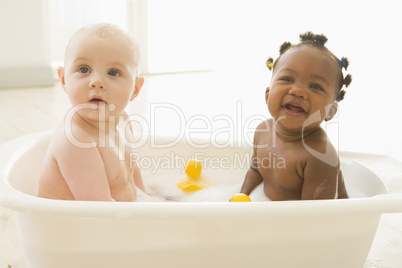 Two babies in bubble bath