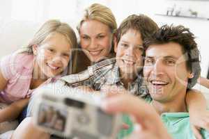 Family taking self portrait with digital camera