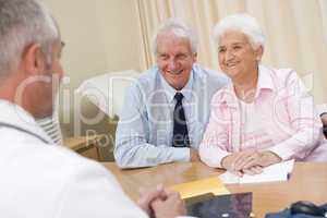 Couple in doctor's office smiling