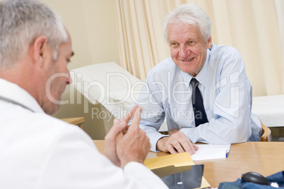 Man in doctor's office smiling