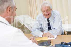 Man in doctor's office smiling