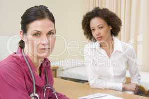 Woman in doctor's office frowning