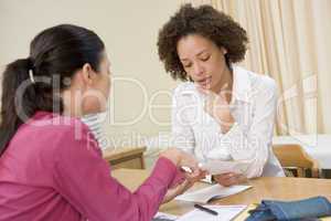 Woman in doctor's office frowning