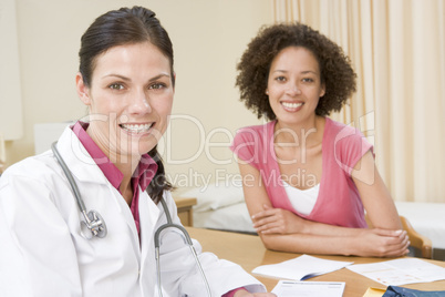 Woman in doctor's office smiling