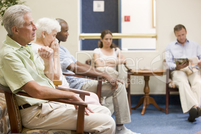 Five people waiting in waiting room