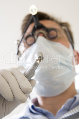 Dentist holding drill