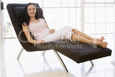 Woman sitting in chair smiling