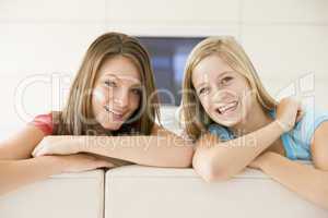 Two women in living room smiling