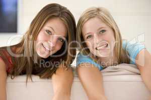 Two women in living room smiling