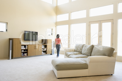 Woman walking through living room