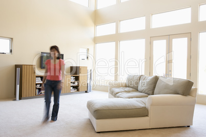 Woman walking through living room