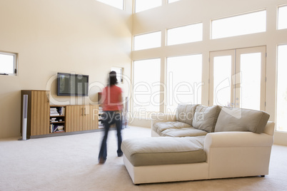 Woman walking through living room