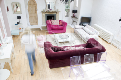 Woman walking through living room