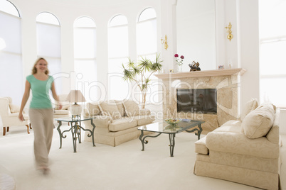 Woman walking through living room