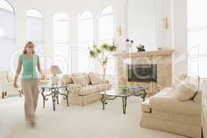 Woman walking through living room