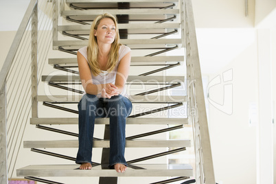 Woman sitting on stairs