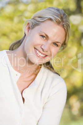 Woman outdoors smiling