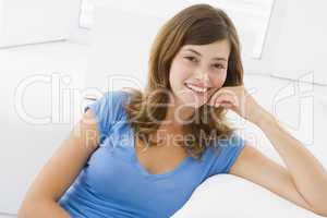 Woman sitting in living room