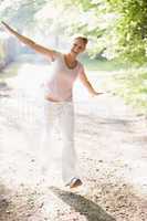 Woman walking on path smiling