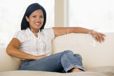 Woman sitting in living room