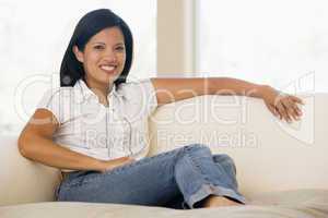 Woman sitting in living room