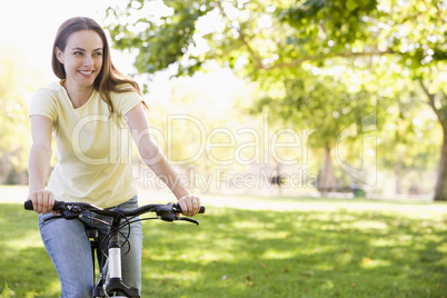 Woman on bicycle smiling