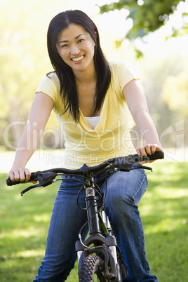 Woman on bicycle smiling