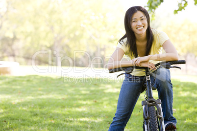 Woman on bicycle smiling