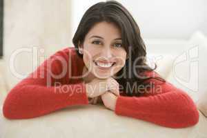 Woman sitting in living room