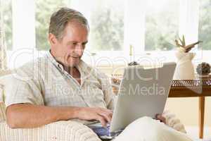 Man in living room with laptop