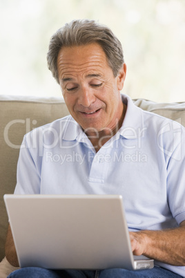 Man in living room with laptop
