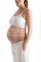Pregnant woman with belly exposed smiling