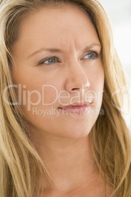 Head shot of woman scowling