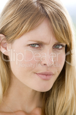 Head shot of woman scowling